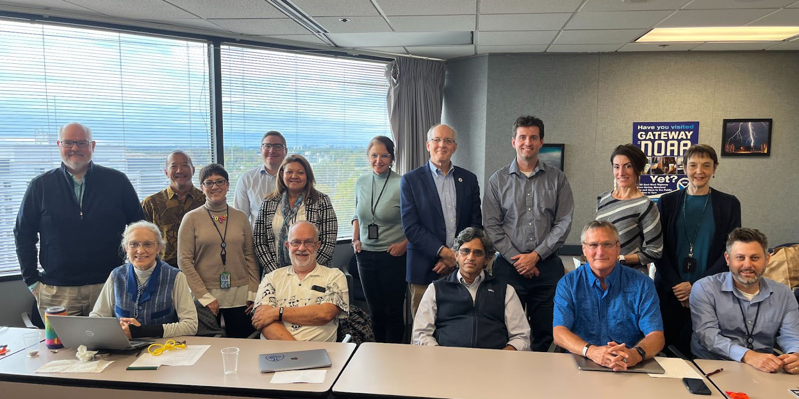 Photo of OSTI leaders and WPO leaders sitting in the meeting room at NWS.