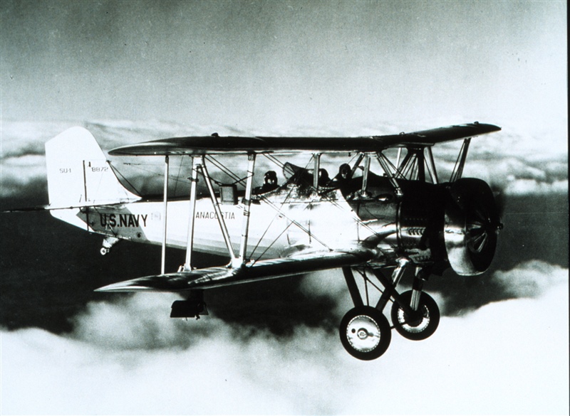 Navy biplane taking weather measurements