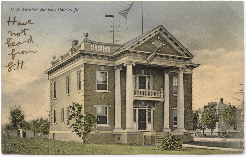 The Weather Bureau office in Peoria, Illinois, in the early 1900's displays its signal flags on the roof. 