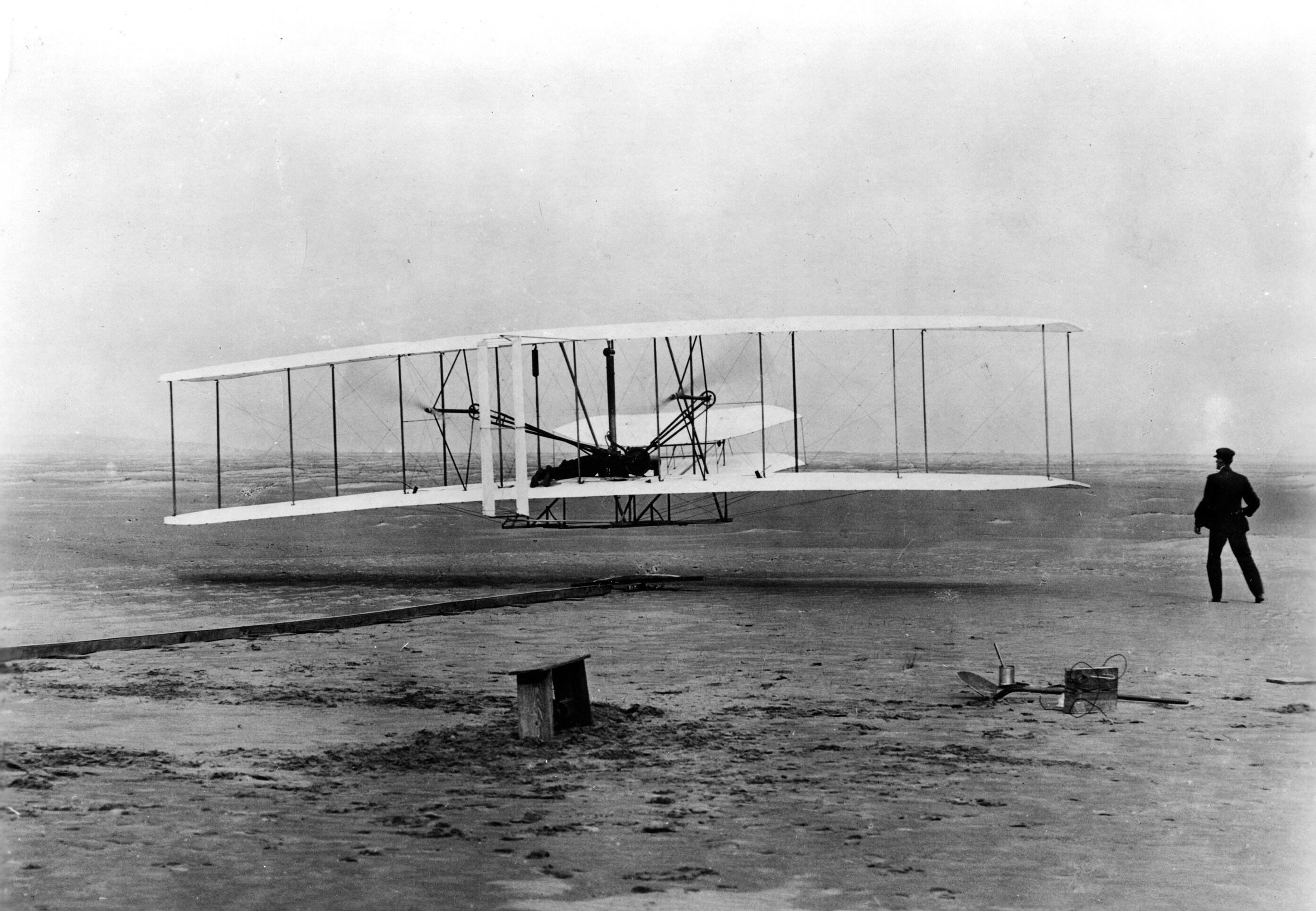 Orville Wright is at the controls as the Wright Flyer takes off under its own power in Kitty Hawk, NC, on December 17, 1903