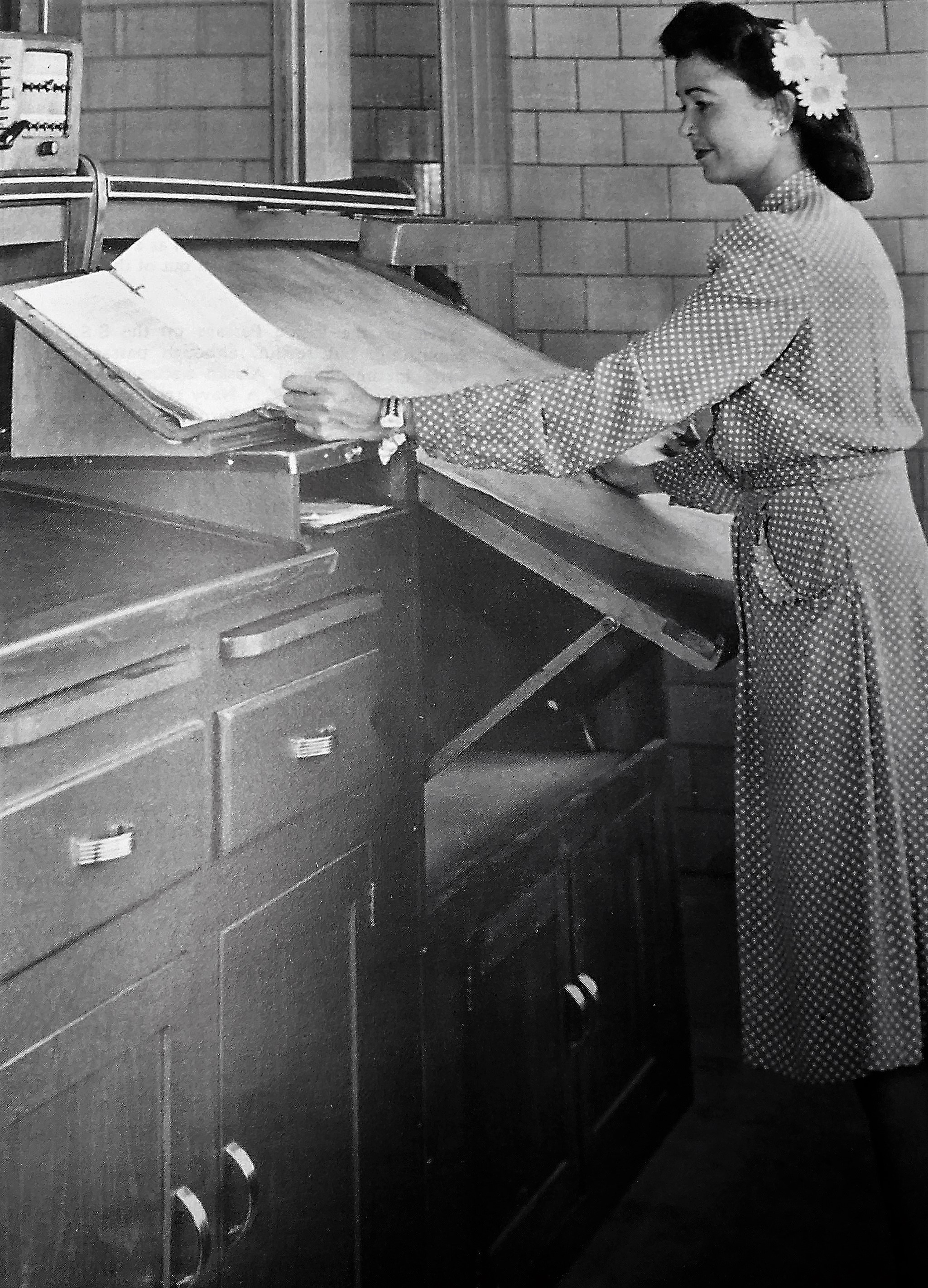 A Weather Bureau employee plots a pilot balloon run.